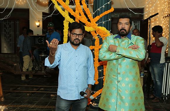 Director with a celebrity on set